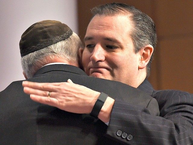 Republican presidential candidate Sen. Ted Cruz, R-Texas, right, hugs businessman Edward C