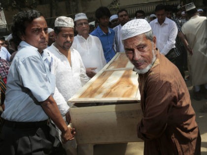 Bangladeshi Muslims carry the body of Xulhaz Mannan who was stabbed to death by unidentifi