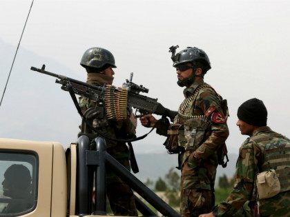 Afghan military soldiers stand stand alert at the entrance gate of the new parliament building after a rocket attack in Kabul, Afghanistan, Monday, March 28, 2016. The Taliban claimed responsibility for firing a series of rockets at Kabul's new parliament building early on Monday. No casualties were reported. (AP Photo/Rahmat …
