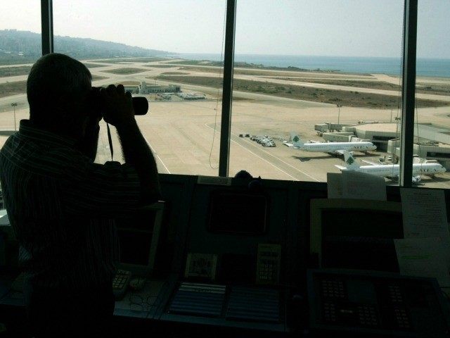 A traffic controller observes at the Rafiq Hariri International Airport during a strike in