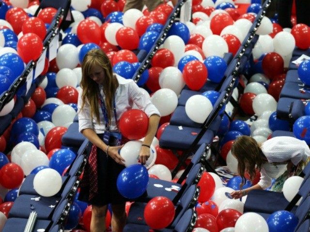 A person stands in balloons during the final day of the Republican National Convention at