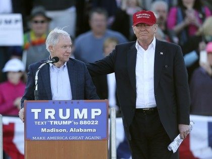 Republican presidential candidate Donald Trump, right, stands next to Sen. Jeff Sessions, R-Ala., as Sessions speaks during a rally Sunday, Feb. 28, 2016, in Madison, Ala. (AP Photo/John Bazemore)