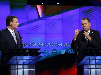 Republican presidential candidate, Ohio Gov. John Kasich, right, speaks as Republican presidential candidate, Sen. Ted Cruz, R-Texas, listens, during the Republican presidential debate sponsored by CNN, Salem Media Group and the Washington Times at the University of Miami, Thursday, March 10, 2016, in Coral Gables, Fla. (AP Photo/Wilfredo Lee)