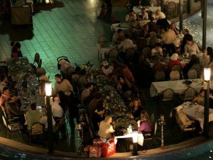 Friday night diners gather in the outdoor area of the Damascus Gate, the world's larg