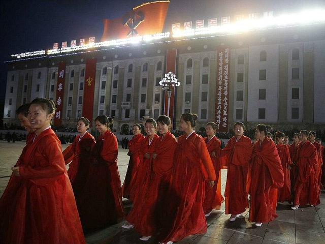 PYONGYANG, NORTH KOREA - OCTOBER 10: (CHINA OUT) Girls dressed in festival costumes to celebrate the 70th founding anniversary of the DPRK's ruling Workers' Party of Korea (WPK) on October 10, 2015 in Pyongyang, North Korea. (Photo by Liu Xingzhe/ChinaFotoPress/ChinaFotoPress via Getty Images)