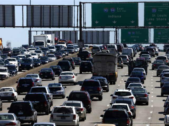 Illinois Might Tax Drivers per Mile -- FILE - In this May 24, 2013 file photo, traffic begins to thicken as motorists getting an early jump to Memorial Day destinations in Indiana and Michigan travel an interstate freeway through Chicago, Illinois . Auto club AAA on Friday, May 16, 2014 …