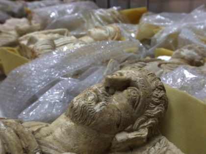 Antiquities are unwrapped as thousands of priceless antiques from across war-ravaged Syria are gathered in the capital to be stored safely away from the hands of Islamic State militants and the ongoing war across most of the country, in Damascus, Syria August 18, 2015. REUTERS/OMAR SANADIKI