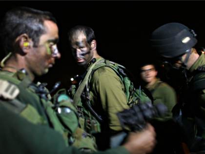 Israeli Defense Force troops prepare to mobilize on January 3, 2009 on the Gaza/ Israel border. The IDF have this evening launched a ground offensive in Gaza in an attempt to take control of Hamas Qassam rocket launch sites in the region. (Photo by Uriel Sinai/Getty Images)