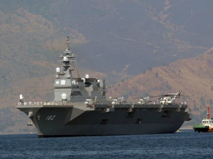 Philippines, Subic Bay Freeport Zone : Japanese helicopter carrier Ise is towed as it prep