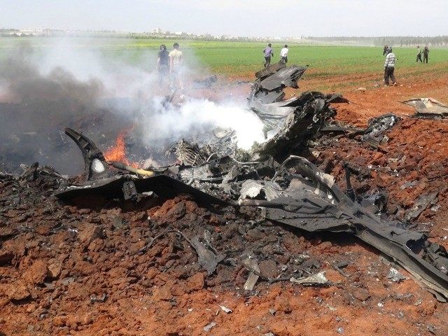A general view shows the wreckage of a government warplane after Al-Nusra front (Al-Qaeda&