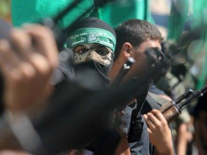 Palestinian Hamas militants take part in a protest against the Israeli police raid on Jerusalem's al-Aksa mosque in Khan Yunis. (photo credit:REUTERS)
