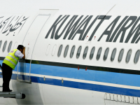kuwait airways A ground crewmember takes a peek inside the cabin of a Kuwait Airways Airbus A340 at the Kuala Lumpur International Airport in Sepang, 01 November 2006.