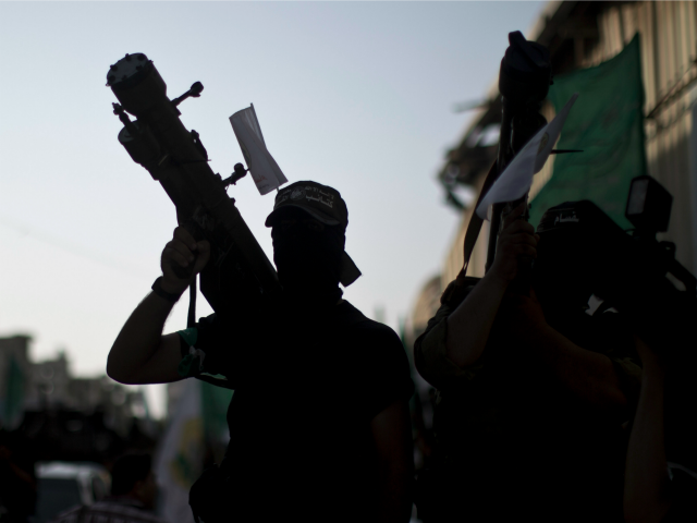 A silhouette of a Palestinian militant from the Ezzedine al-Qassam brigade, the armed wing of Hamas, carries a Man Portable Air Defence System (MANPAD) during a march in Gaza City on September 14, 2013.