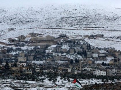 Snow covers the mountain side in the West Bank city of Nablus on February 20, 2015, follow