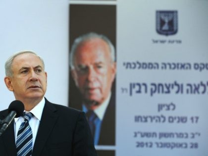 Israeli Prime Minister Benjamin Netanyahu speaks as he stands by the grave of Israeli Prime Minister Yitzhak Rabin during a memorial ceremony marking the 17th anniversary of the assassination of Israeli Prime Minister Yitzhak Rabin, October 28, 2012 in Jerusalem, Israel.