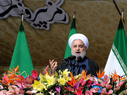 Iranian President Hassan Rouhani delivers a speech during a rally in Tehran's Azadi Square (Freedom Square) to mark the 37th anniversary of the Islamic revolution on February 11, 2016.