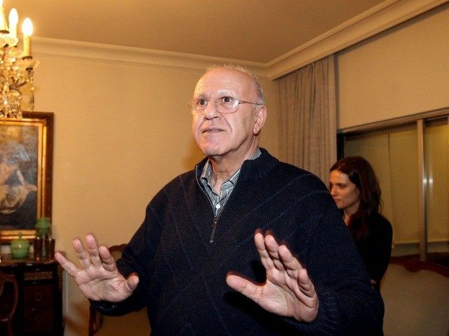 Former Lebanese minister Michel Samaha (C) gestures upon his arrival at his home in the re