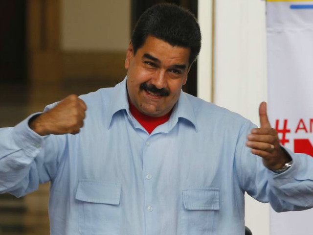 Venezuela's President Nicolas Maduro gestures as he speaks during a march, at Miraflores Presidential Palace in Caracas, Venezuela, Thursday, April 7, 2016. Groups allied to Venezuela's socialist administration marched to protest an amnesty law passed by the opposition controlled congress calling for release of those it deems to be political …