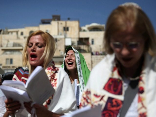 Israeli members of the liberal Jewish religious group Women of the Wall wear 'Tallit', traditional Jewish prayer shawls for men, as they pray at the Western Wall plaza outside the women's section in Jerusalem's Old City, on April 24, 2016, after they were banned from conducting the first-ever' women's priestly …
