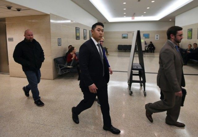 New York Police Department (NYPD) rookie officer Peter Liang (C), is sentenced to five yea
