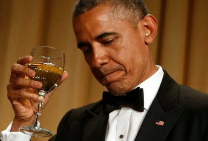 US President Barack Obama makes a toast at the White House Correspondents' Association Dinner, in Washington, DC, on April 25, 2015