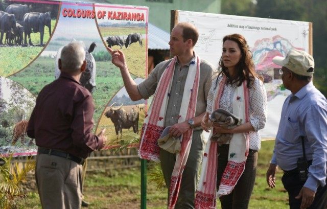 Britain's Prince William and Catherine, Duchess of Cambridge speak with Indian forest offi