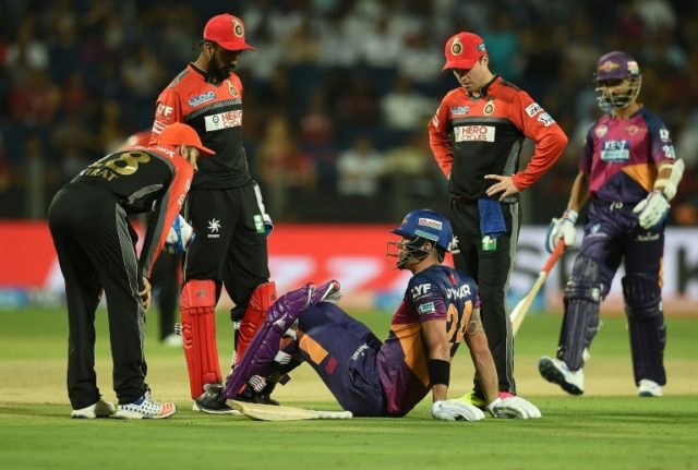 Rising Pune Supergiants' Kevin Pietersen sits on the ground after sustaining an injury whi