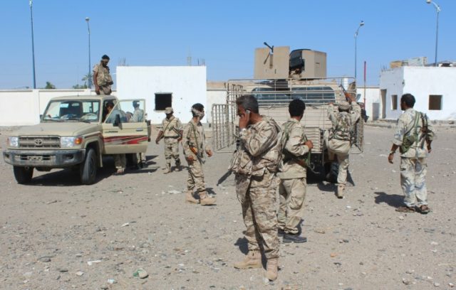 Forces loyal to the Saudi-backed Yemeni president patrol a street in the southern city of