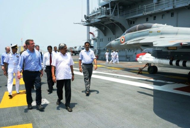 US Secretary of Defence Ashton Carter (L) tours the Indian Navy's flagship INS Vikramadity