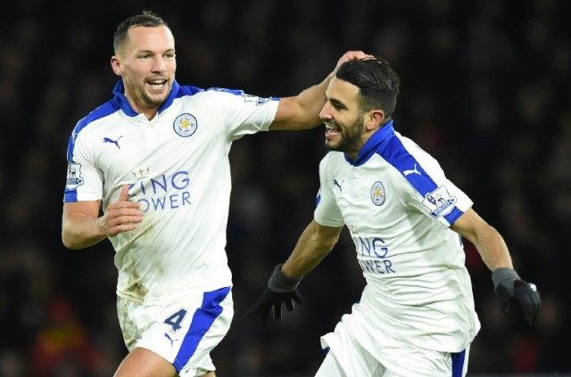 Leicester City's midfielder Riyad Mahrez (R) celebrates with Danny Drinkwater during the E