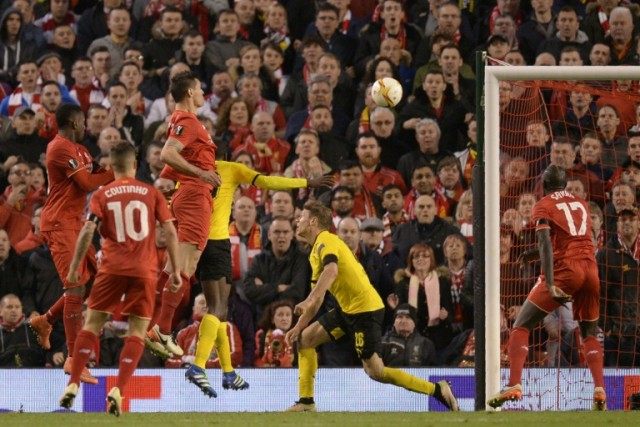 Liverpool's defender Dejan Lovren (3rdL) heads the ball to score the winning goal on April