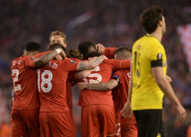 Liverpool players celebrate after winning the Europa league quarter-final against Borussia