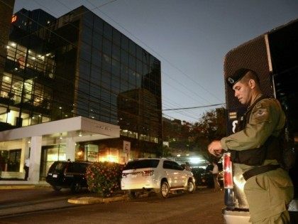 Police stand guard outside the Mossack Fonseca law firm offices in Panama City during a raid on April 12, 2016