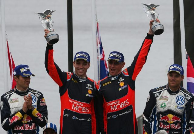 New Zealander driver Hayden Paddon (2nd-L) and his compatriot co-driver John Kennard (2nd-