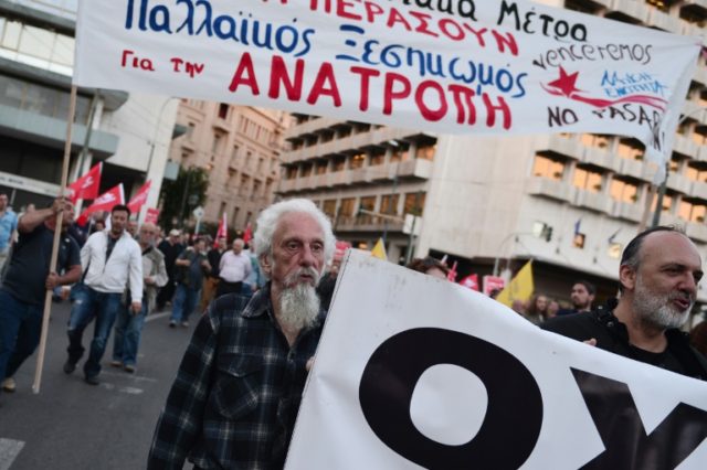 Greek public sector employees and leftist protesters march in central Athens over pension