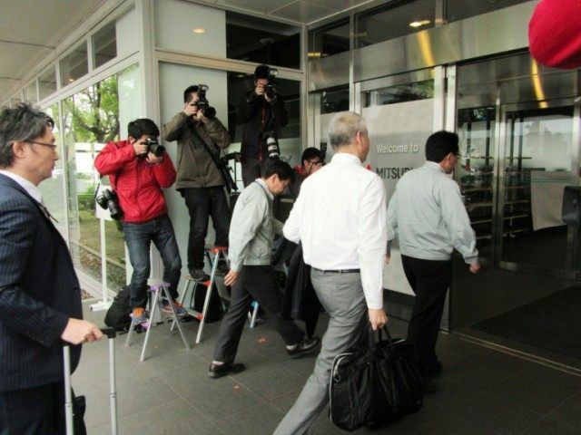 Officers from the transport ministry enter the Mitsubishi Motors Nagoya factory in Okazaki