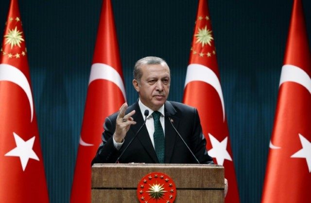Turkish President Recep Tayyip Erdogan delivers a speech to lawyers at the Presidential Co