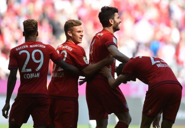 (L-R) Bayern Munich's Kingsley Coman, Joshua Kimmich, Serdar Tasci and Thomas Mueller cele