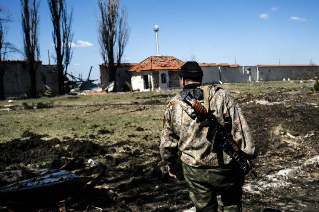 A pro-Russian rebel on patrol near Donetsk airport in eastern Ukraine