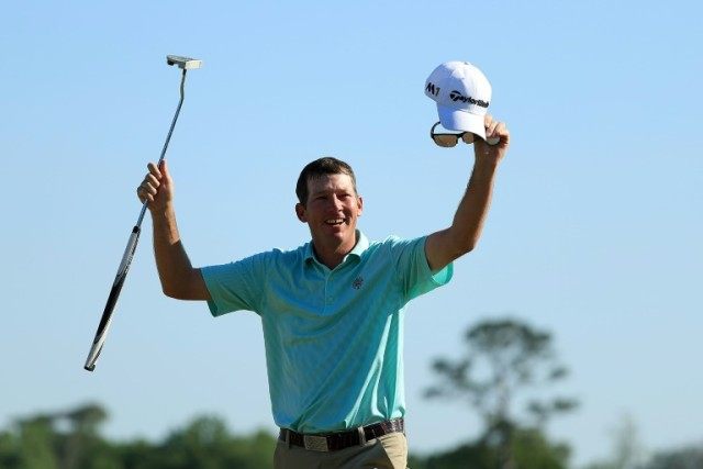 Jim Herman of the United States celebrates his victory on the 18th green during the final