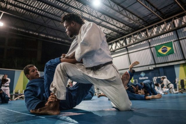 Congolese judoka Popole Misenga (R) is pushing to compete in the Rio Olympics as part of t