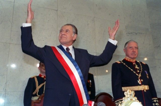 Chilean President Patricio Aylwin (L) gestures on March 11, 1990 in Valparaiso, Chile, aft