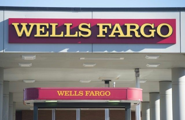 Wells Fargo dipped 0.2 percent after reporting a 5.9 percent drop in net income to $5.5 bi