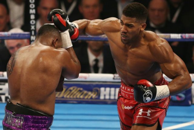 British boxer Anthony Joshua (right) vies against Dillian Whyte during their British and C