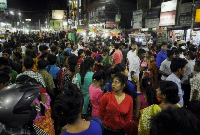 People crowd onto the street during an earthquake in Agartala, capital of India's northeas