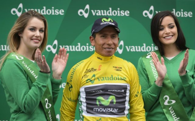 The overall leader wearing his yellow jersey, Colombian Nairo Quintana, is applauded durin
