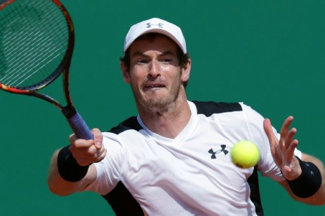Britain's Andy Murray hits a return to Canada's Milos Raonic during their match at the Mon