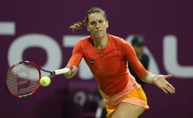 Andrea Petkovic (pictured) showed an iron will after being demolished in the first set aga