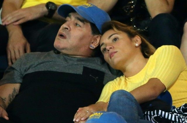 Argentinian football legend Diego Maradona (L) and with his girlfriend Rocio Oliva, pictur