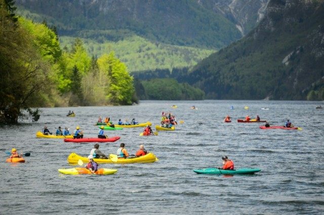 Canoeists and kayakers out on Lake Bohinj in Slovenia on April 16, 2016